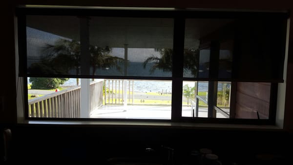 Beach house sunscreen roller shades for sun and UV protection