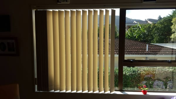 Beach house vertical blinds for light and privacy