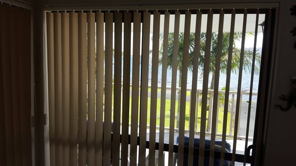Beach house vertical blinds for light and privacy