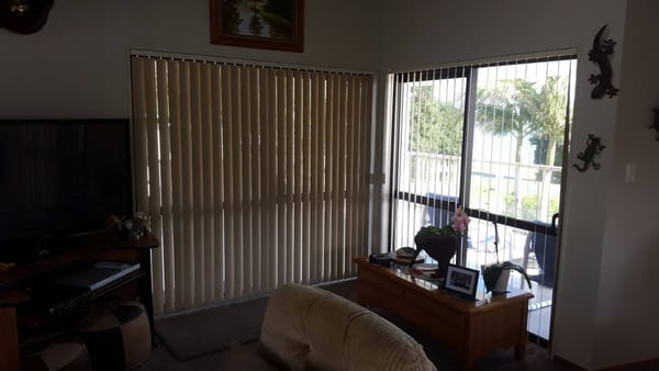 Beach house vertical blinds for light and privacy