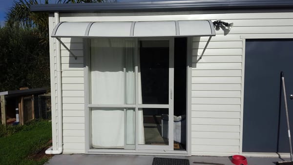 Hardtop light-filtering fibreglass awning for a man cave