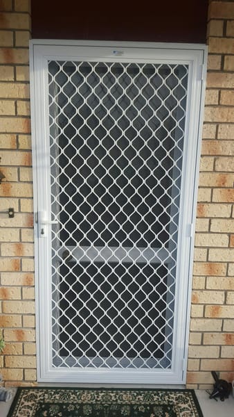 Hinged security screen door with build-out frame